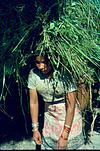 Young girl with a hay load