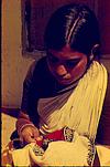 Toda woman doing her embroidery