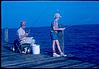 Father and son fishing, California, coast, 1964