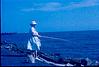 Lady fishing on the Mississippi lake, 1964