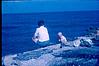 Mother and child on the banks of lake, 1964