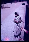 A young beggar in street in Goa
