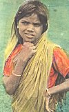 A young girl in an adult sari