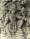 Lord Vishnu seated on a seven hooded cobra (Shesha)