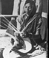 A Gonda woman weaving mat