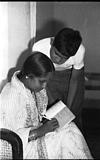 Dr. Vijaya and Vikas, signing in an autograph, 1982