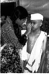 Vibha applying kajal to Pradeep. Honnawar, 1982