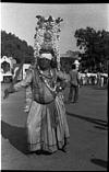 A folk dancer carrying number of pots on his head, Mysore, 1985
