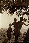 A family stops to see how far they still have to walk