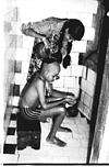 Vibha giving bath to brother Pradeep, 1982