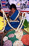 Woman selling flower garlands