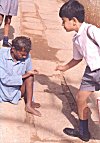 A school boy donates for his success in exam.