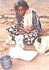 A destitute woman takes to begging as a last resort