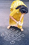 Woman Spreading Rangoli
