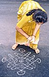 Woman Spreading Rangoli