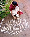 Even a college girl takes rangoli very seriously.