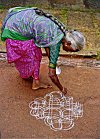 Woman in Sari Decorates the Front Yard