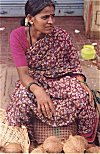 Road-side ripe coconut seller.