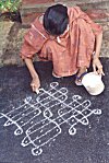 Her expert hands draw a rangoli in no time!