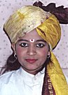 A young woman looks very charming in a turban.