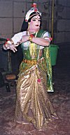 Man Dressed As a Woman Poses Backstage for a Photo