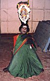 A Devotee Balancing an Idol