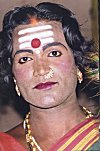 Man Dressed as Woman in Devotion