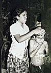 A sister giving bath to her brother