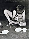 Boy Eating a Snack in a Konkani Household