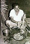 Man Cleaning a Bird for Special Meal