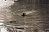 A girl bathing in a public pond