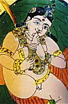 Krishna licking butter off his foot