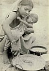 A Refugee Cooking for Child in Bengal