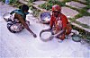 Women power chalk for Rangoli