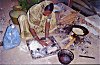 A construction worker preparing dinner on the street