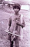 Boy Begging with a Country Musical Instrument