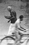Man Rushing to Puja ( Prayer) House