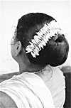 Jasmin Flowers on a Woman's Hair-Bun