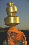 Woman Bringing Water from Village Well