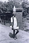 Milkman Walks to Work Balancing a Can of Milk on His Head