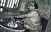 Woman Hand-grinds Spices