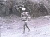 Man Balancing Baskets on Shoulder