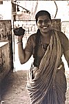 Woman Carrying Cow dung