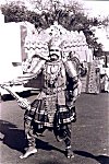 Folk artist dressed as the ten headed king Rawana