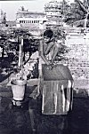 Handicapped Boy Washing Clothes With His Feet