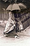 Girls Sharing an Umbrella