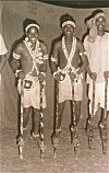 Dancers Walking on Stilts