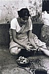 Woman preparing fish-head soup