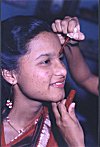 A Young Girl being helped with the Red Dot