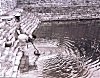 Woman Fetching Water at a Tank